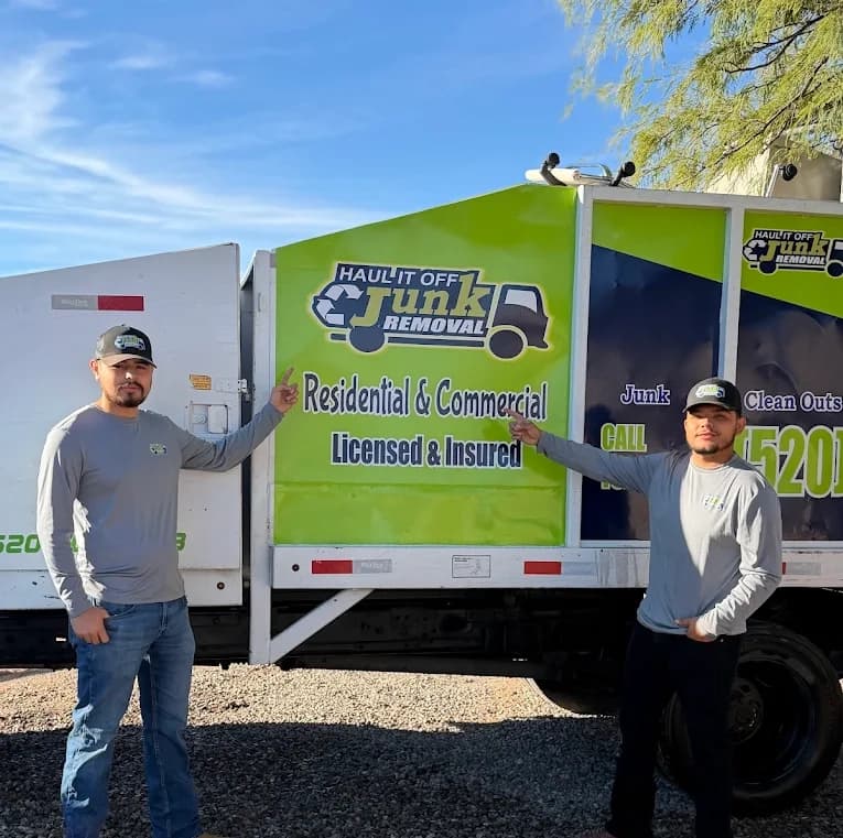 Haul It Off Junk Removal crew loading junk in Tucson